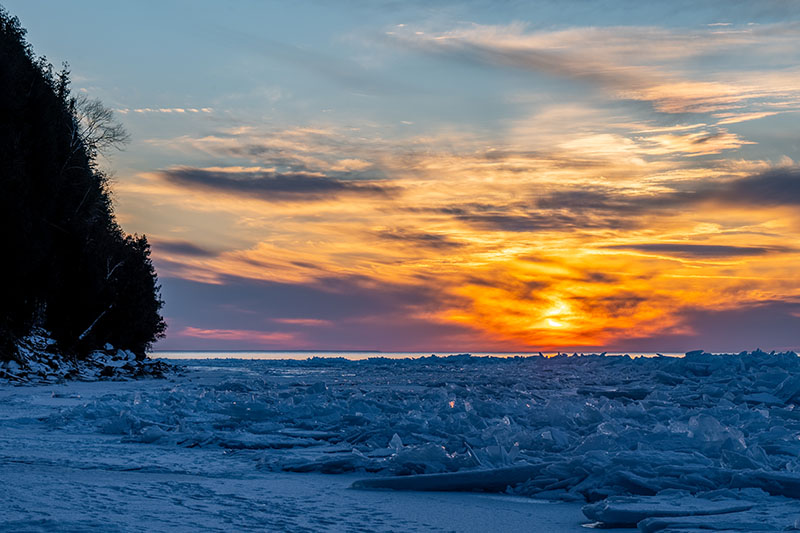 One of the best winter things to do in Door County, the Door Bluff Headlands ice shove at sunset.