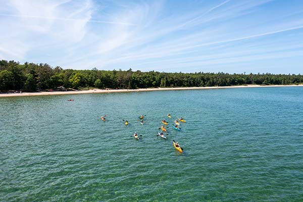 An aerial view of a group of kayaks